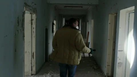 Stalker exploring Pripyat ghost town in Chernobyl Stock-Footage 332830138