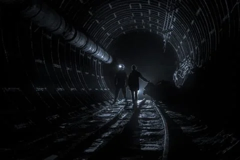Stalker in the subway tunnel Stock Photos