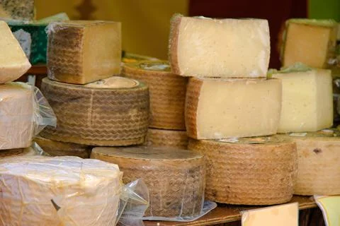 Stall with cured cheeses from different places with tasting. Stock Photos