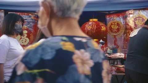 Stall selling Chinese New Year decors at Eng Ann morning market Stock Footage 231762353