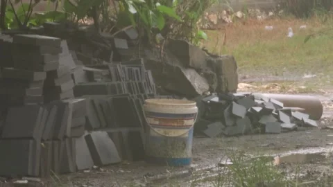 Stalled Construction Project With Abandoned Building Materials In Heavy Rain Vídeos de archivo 332059597
