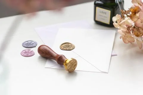 Stamp and envelopes on a light table with documents Foto stock