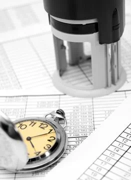 Stamp and watch on the documents 写真素材