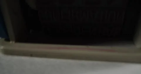 A stamp CANCELLED is placed on a sheet of white paper, close-up Stock Footage 251588511