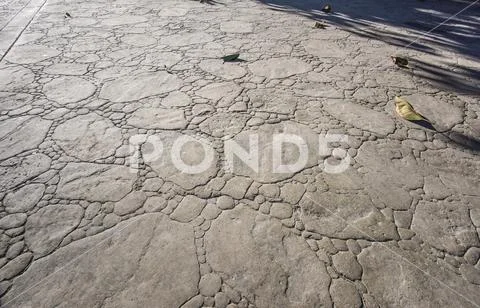 Stamped concrete pavement outdoor, boulders stones pattern, flooring exterior Stock Photos