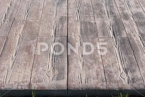 Stamped concrete pavement outdoor, Wooden slats pattern, flooring exterior close Stock Photos