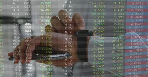 Stamping rubber date stamp using right hand over office desk, showing stock data Fotos Stock