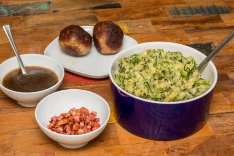 Stamppot with endive, mashed potatoes and meatballs Stock Photos