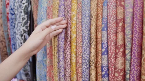 Stand of the colorful embroidered with threads and stamp print clothes in Stock Footage 85699338