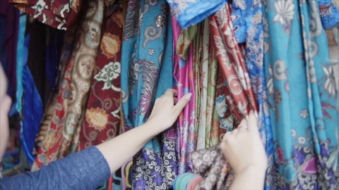 Stand of the colorful embroidered with threads and stamp print clothes in Stock Footage