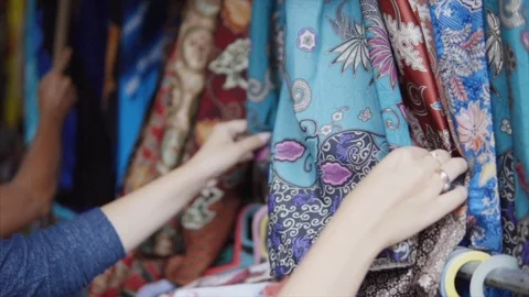 Stand of the colorful embroidered with threads and stamp print clothes in Stock Footage 86225834