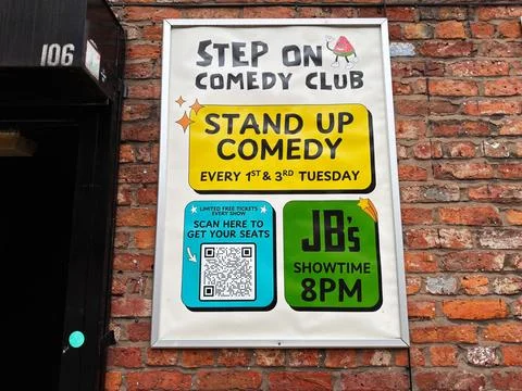 Stand up comedy poster on brick wall outside Step On Comedy Club in Manches.. 写真素材