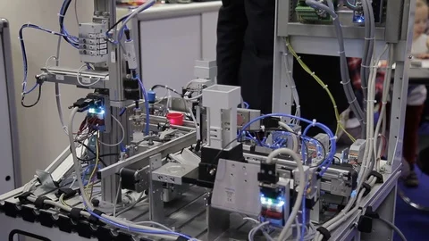 At stand demonstration of process of manufacturing parts on conveyor. Stock Footage 86746329