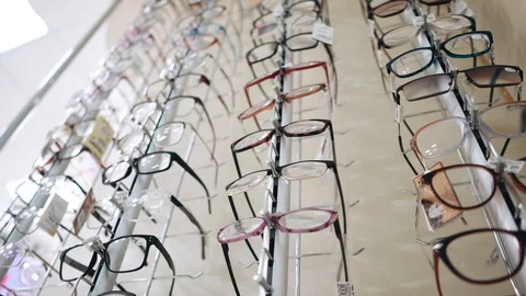 Stand with glasses in a pharmacy. Care for vision. Ophthalmology. Stock Footage 127727601