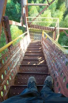 Stand high on a rusty staircase Stock Photos