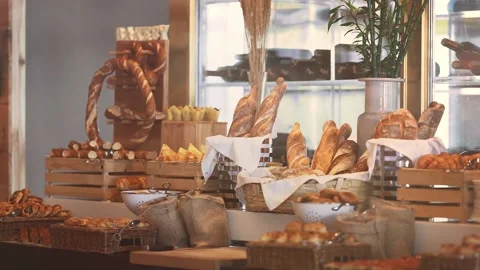 Stand of hot fresh breads in bakery Stock Footage 130673353