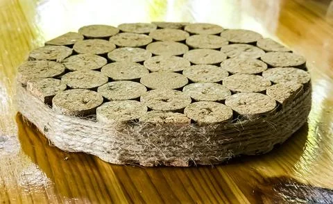 A stand for hot objects made from wine corks. Kitchen items. Stock Photos