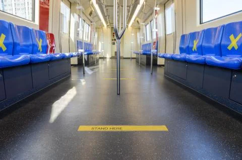 Stand lines on the floor in public train with social distancing protect Stock Photos