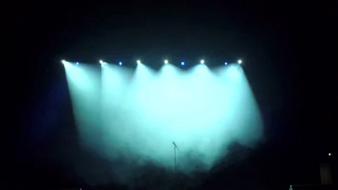 Stand with a microphone on stage in the spotlights Stockbeeldmateriaal 83335392