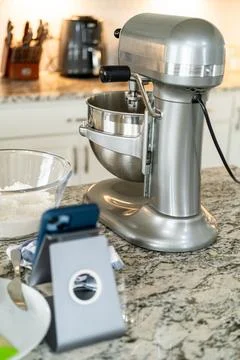 Stand mixer and kitchen tools on countertop close up Stock Photos