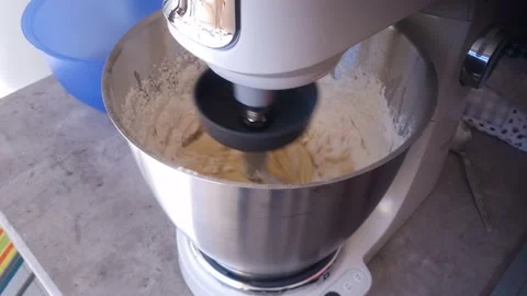 Stand mixer kneading dough with hook accessory in a steel bowl Stock Footage 237435629