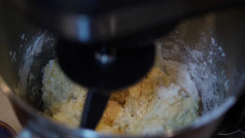 Stand mixer preparing Dough. Electric Hook Machine mix Flour Water slow motiion. Stock Footage 127790467