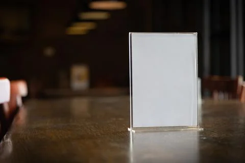 Stand Mock up Menu frame closeup tent card white frame blurred background d.. 스톡 사진