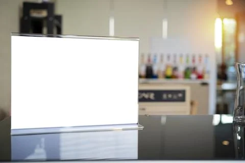 Stand mock up menu frame standing on wood table in bar restaurant cafe. space Stock Photos
