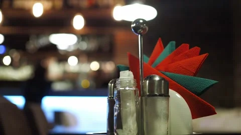 A stand with napkins on the table in a cafe with a blurred bokeh. the people in Stock Footage 169758558