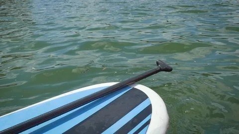 Stand Up Paddle Board on a Lake in Slow Motion Stock Footage 95554597