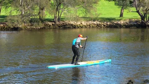 Stand Up Paddle Boarder Racing in the Avon Descent on River in Perth, Australia Stock Footage 344325888