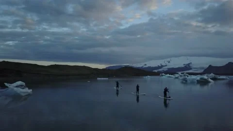 Stand up paddle boarders rowing in arctic ocean Stock-Footage 166863254