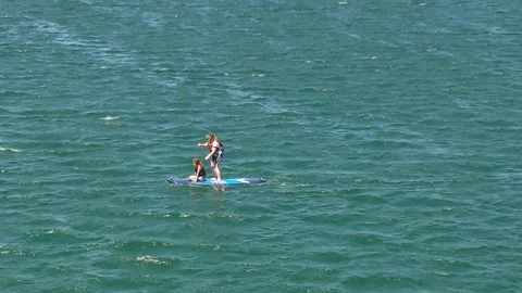 Stand Up Paddle Boarding on a windy day in Cascais, Portugal Stock Footage 277282958