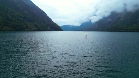 Stand-Up Paddling at a mountain lake Stock Footage