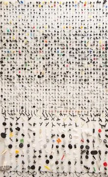 Stand with plastic multi colored clips for the car in a car parts store. Stock Photos