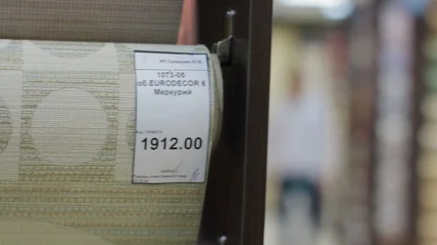 Stand with rolls of wallpaper Samples in store Video stock 91140958