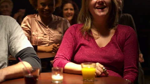 A stand up show ends and the audience claps for the performer Video stock 33998466