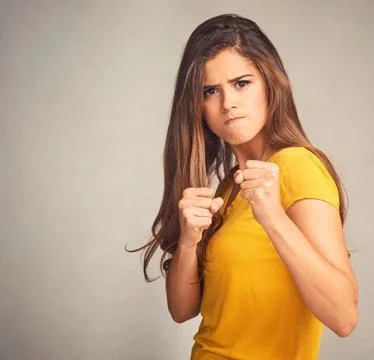 Stand up for what is right. Studio shot of an attractive woman putting up her Stock Photos
