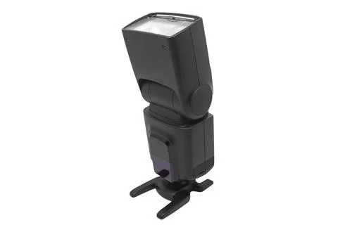 A standalone black external camera flash speedlight mounted on a hot shoe s.. Stock Photos