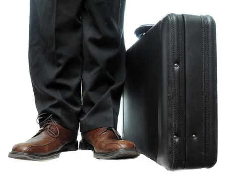 A standard, default black briefcase with handle at top isolated on a pure whi Stock Photos
