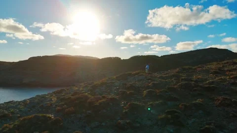 Standing Above the Clouds: Epic Sunrise at Cala Torta Stock Footage 327271065