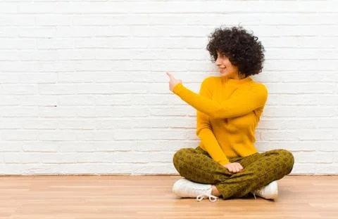 Standing and pointing to object on copy space, rear view Stock Photos
