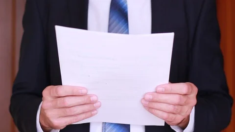 Standing and thumbing through documents 動画素材 90833999