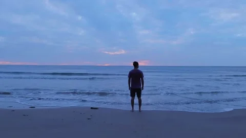 Standing on the Beach At Sunrise 스톡 동영상 253910025