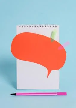 Standing blank spiral notepad speech bubble arrow banners pen above lying cool Stock Photos