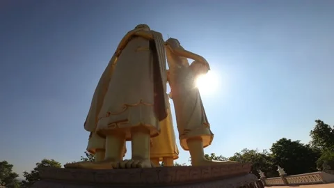  standing buddha statue with blue sky and clounds at Wat Doi Sapphanyu Temple in Stock Footage 237931107
