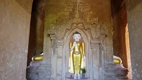 Standing Buddha statue inside Pagoda, seated Buddhas knees, Bagan, Myanmar 스톡 동영상 78664643