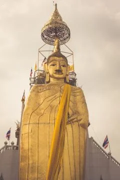 The standing Buddha of Wat Intharawihan in Bangkok, Thailand. Stock Photos