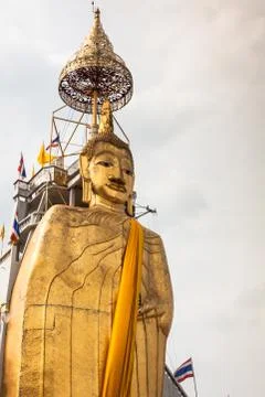 The standing Buddha of Wat Intharawihan in Bangkok, Thailand. Stock Photos