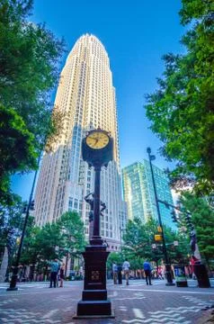 Standing by the clock on city intersection at charlotte downtown Stock-Fotos
